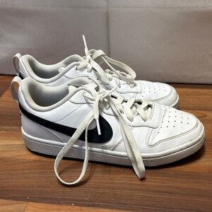 Nike White Low-Top Sneakers with Black Swoosh